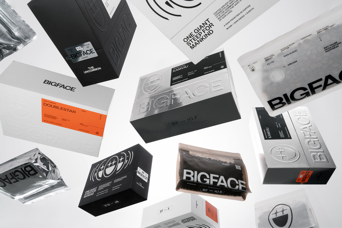 Several BIGFACE coffee boxes floating in the air