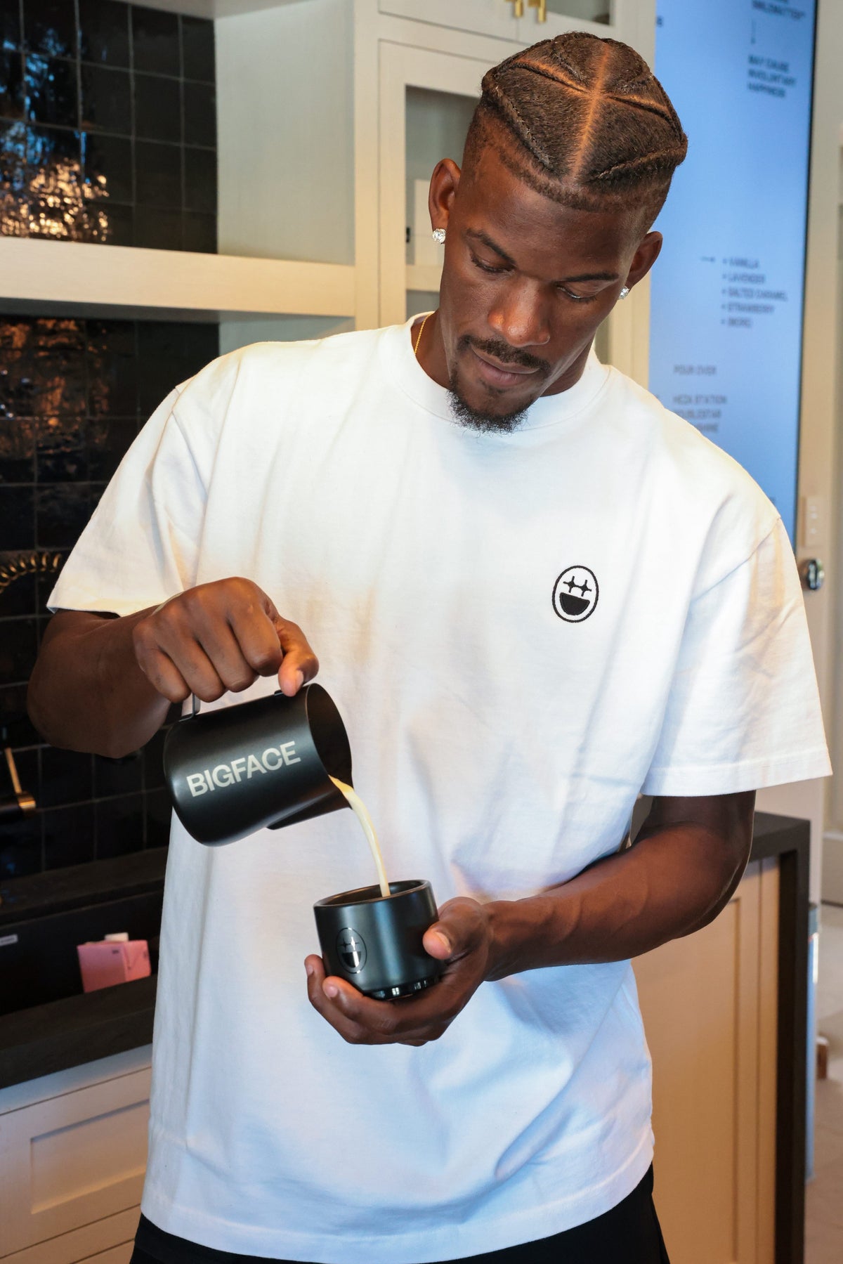 Jimmy pouring milk into a BIGFACE cup