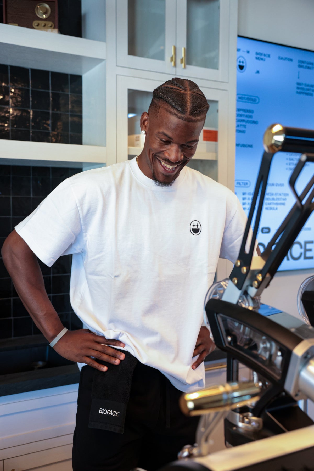 Jimmy grinning at the espresso machine